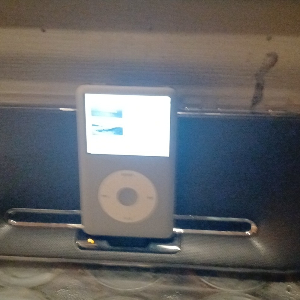 White iPod with Phillips Speaker Dock